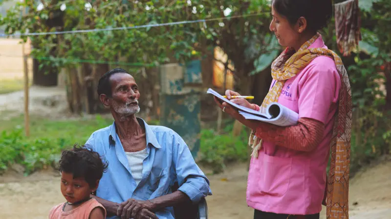 Female health worker wearing pink