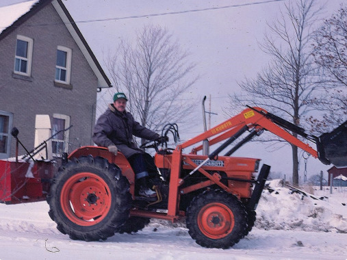 Roland with his tractor. He used it to rescue stuck cars during snowstorms