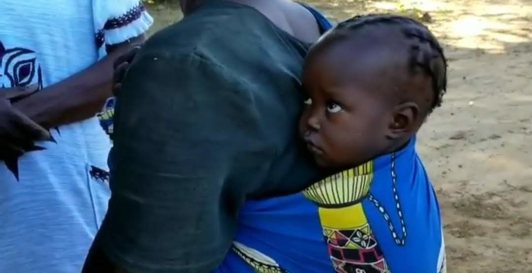 A young child shyly turns away when greeted|Operation Eyesight's Presidnet with a woman who received sight-restoring eye surgery thanks to our donors|A young child shyly turns away when greeted|A young child shyly turns away when greeted