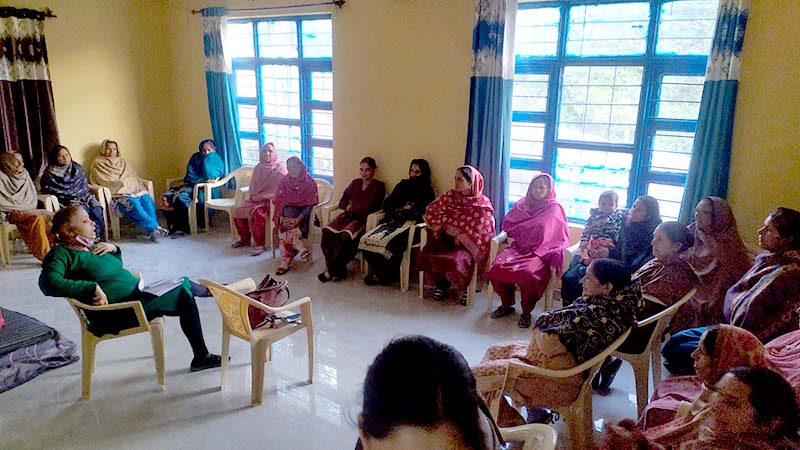A group of women sitting around a room