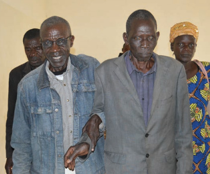 Bernard (with glasses) is one of 72 community health volunteers trained at Kitale District Hospital.|Bernard (left) was once blind from cataracts. Today he regularly walks great distances to check on rural families to identify eye injuries