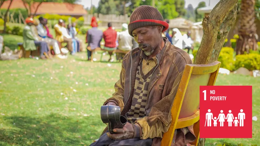 A man sits outside on a chair working on a leather shoe.||A man sits outside on a chair working on a leather shoe.SDG 1 - NO POVERTY - Kenya Abraham