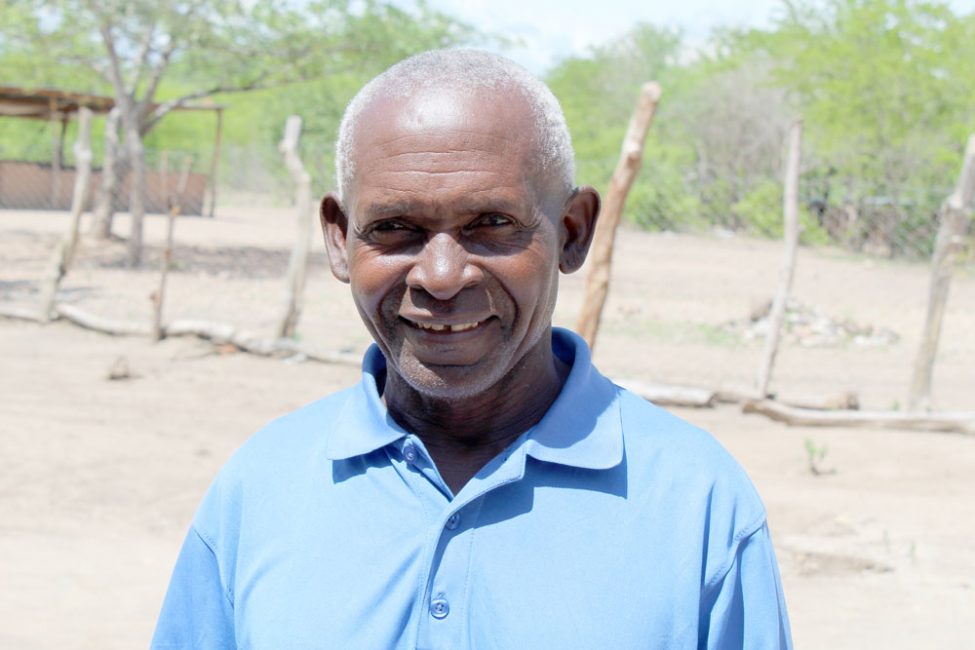 Portrait of Samson|A young man looks at the eyes of a senior man using flash light