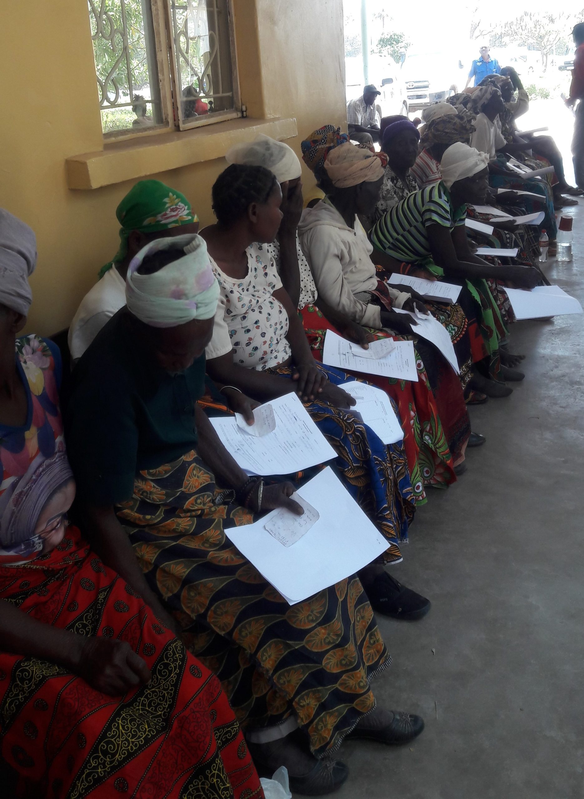 Women in Zambia lining up to have their eyes screened at an Operation Eyesight screening and outreach program.|Zambian woman received sight-saving trachoma treatment through Operation Eyesight
