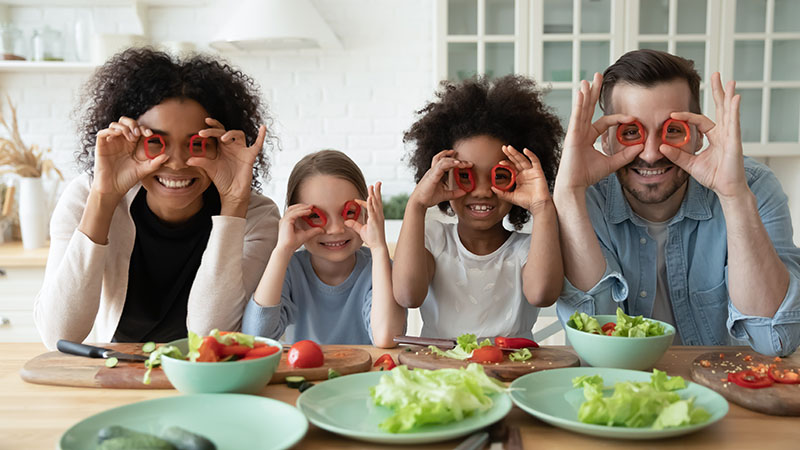 A family of four poses for the camera